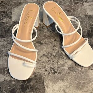 Lulu’s white strappy heels